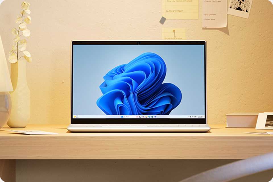 Home screen displayed on a Windows 11 PC sitting on a table top.