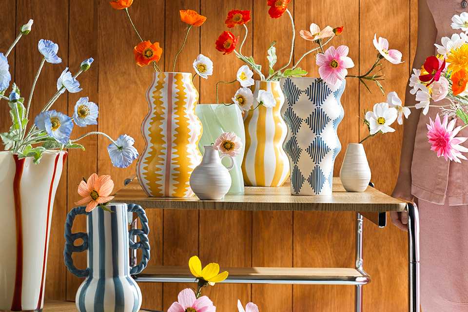 Habitat vases filled with flowers.