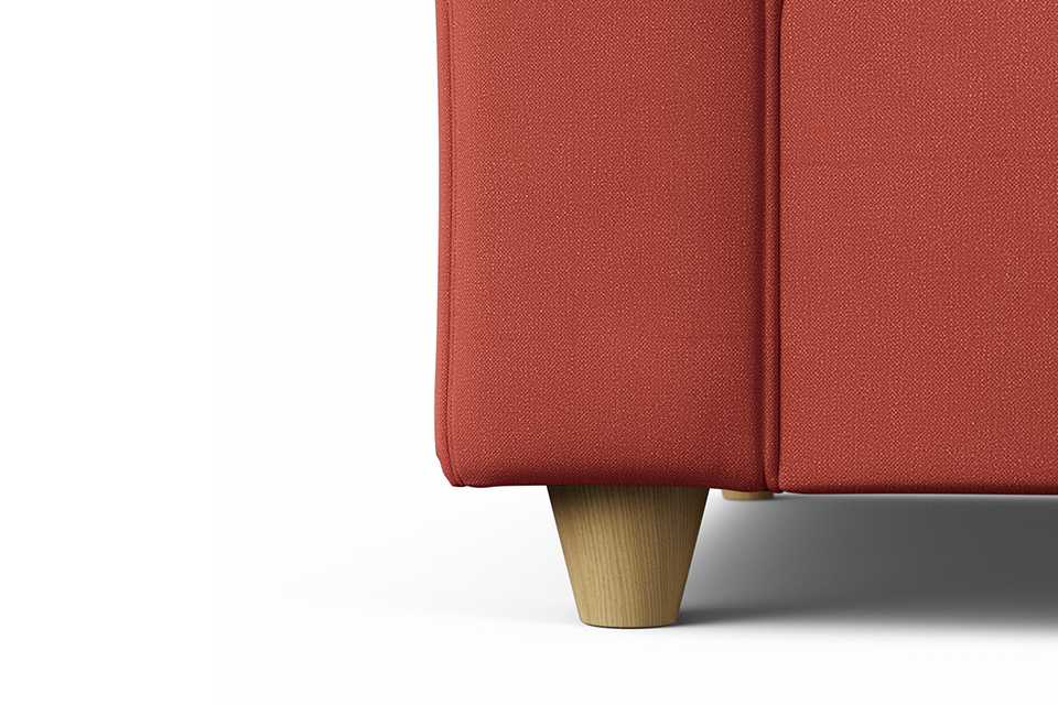 Close-up view of the leg of Habitat Whitby Fabric 4 Seater Sofa - Papaya - Ash Leg.