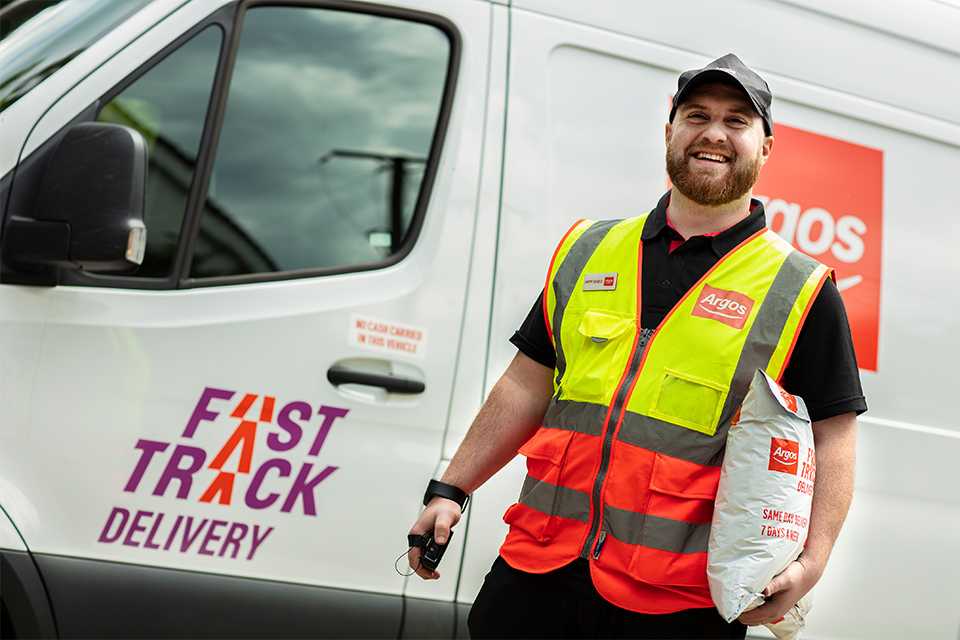 Two Argos drivers deliver a package.