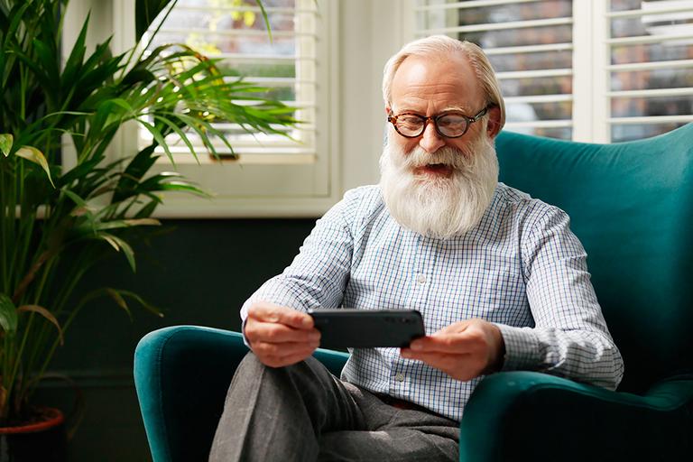 Man watching a Doro smartphone.