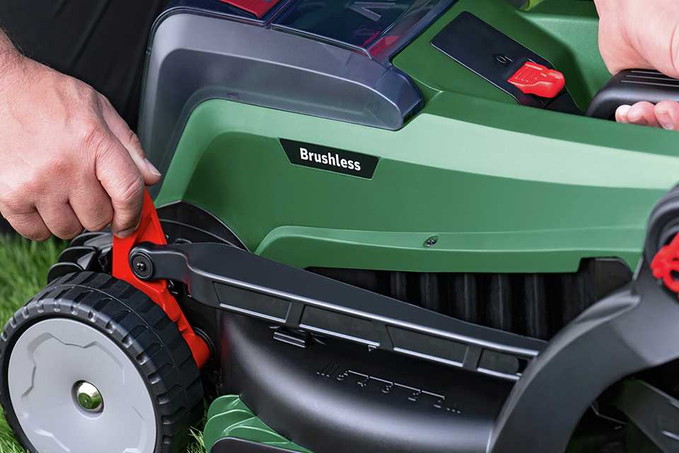 A man changing the cutting height on a Bosch UniversalRotak 37cm cordless rotary lawnmower.