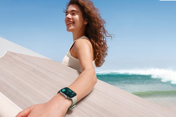 woman wearing a smart watch to go surfing