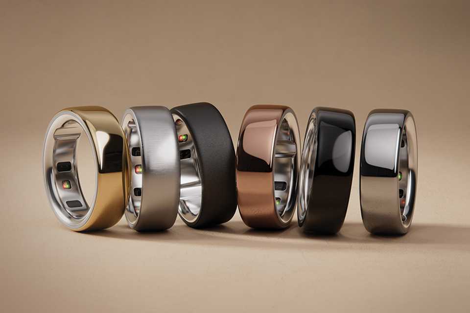 A collection of Oura rings on a gradient background.