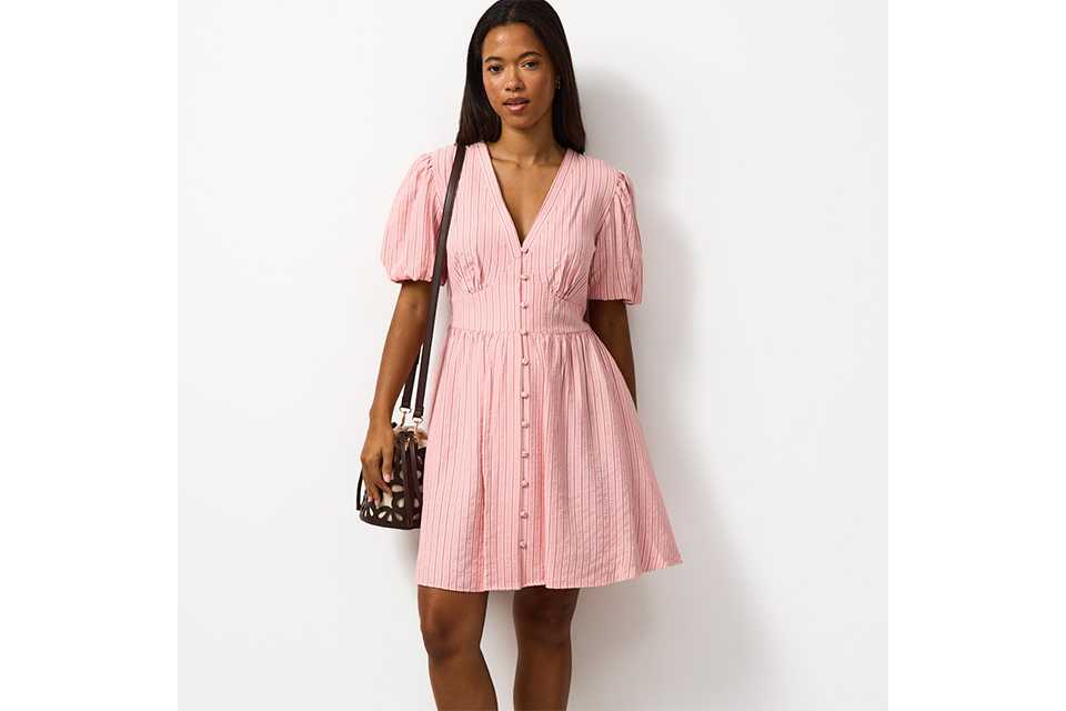 Light summer dress styled with minimal accessories, ideal for relaxed holiday outfits in warm climates.
