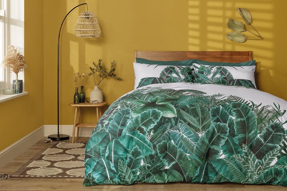 A vibrant bedroom with tropical tones and botanical decor.
