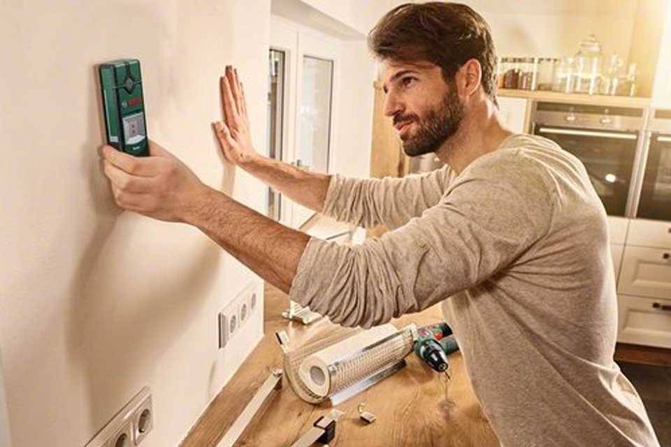 Man removing ceiling light.