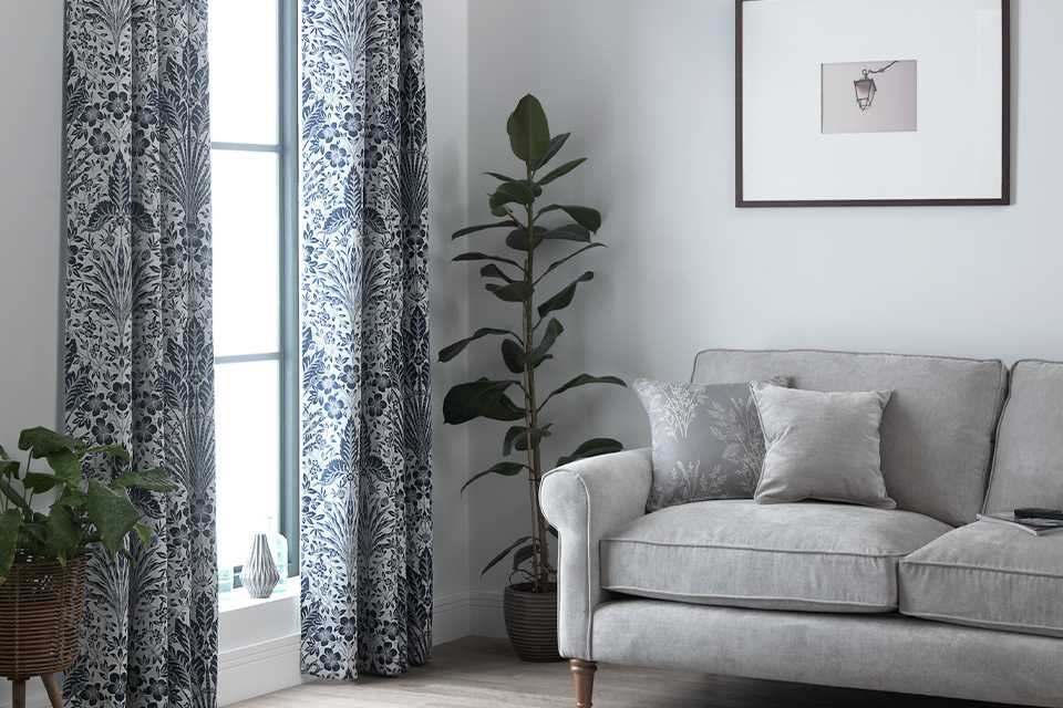 Living room with patterened curtains.