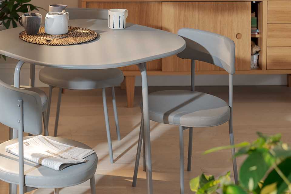 Grey dining table and chairs set.