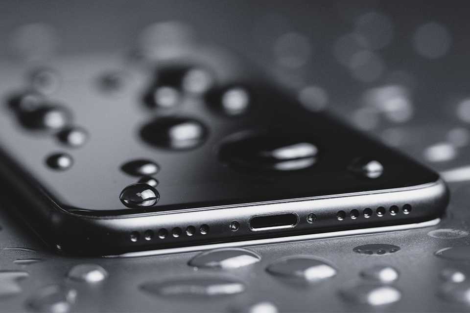 Water droplets on a phone screen.