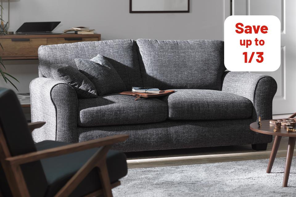 Image of grey sofa in white living room.