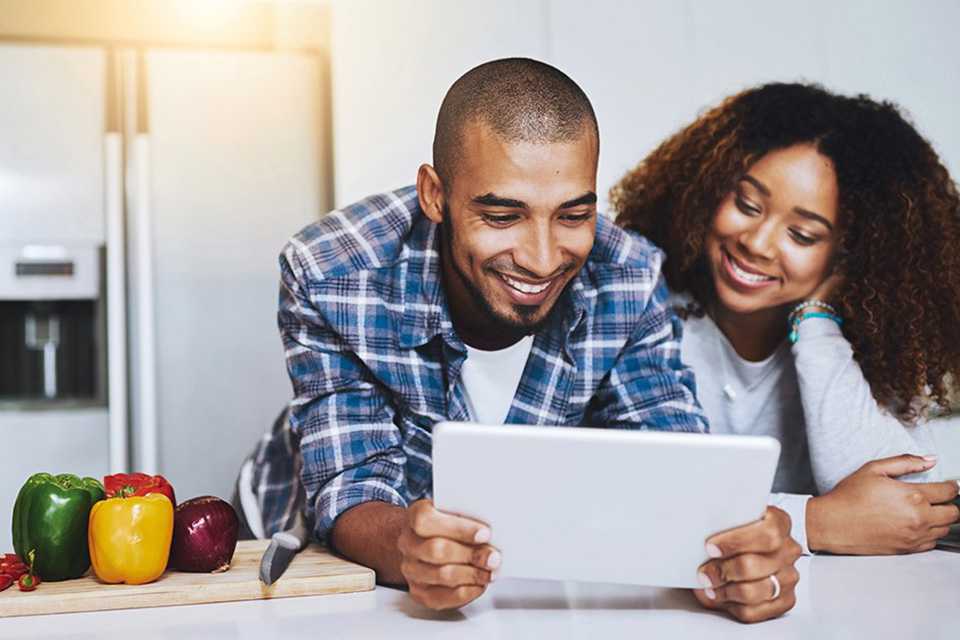 Couple browsing on tablet.
