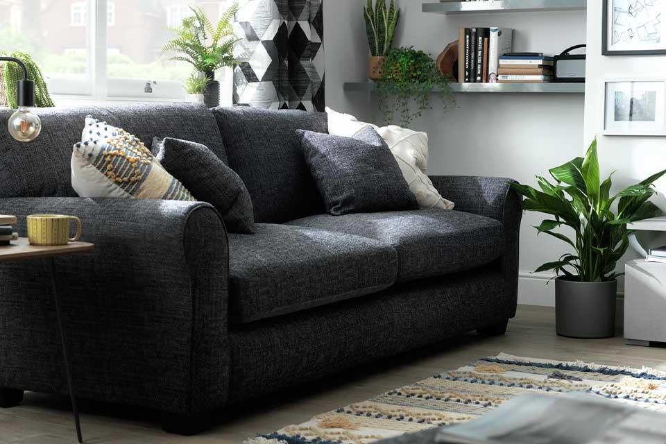 Charcoal Habitat Lisbon 4 seater sofa in a modern lounge setting.