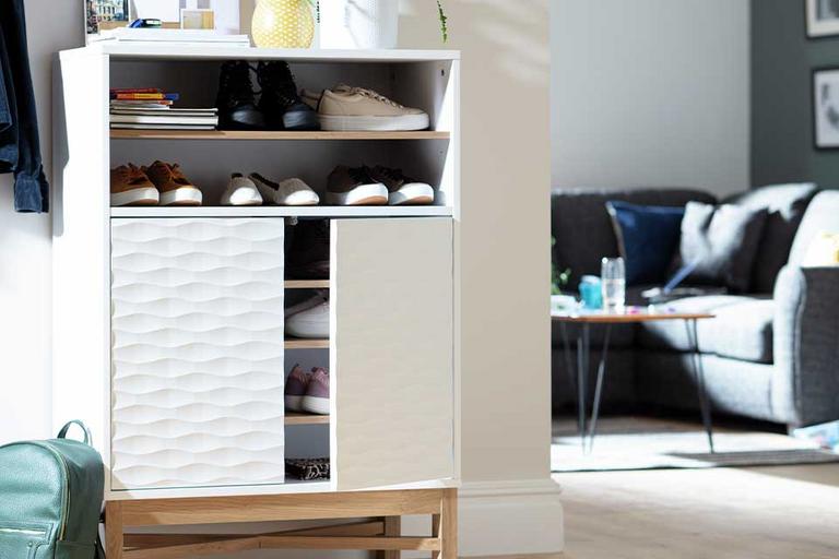 The Habitat Zander white unit with a textured front being used to store shoes in a hallway.