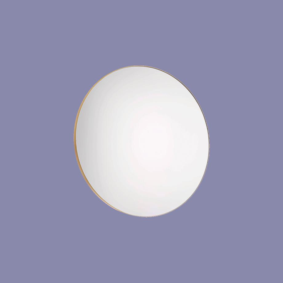 Circle mirror with gold rim.