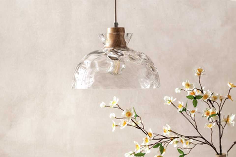 Pendant ceiling light hanging above table.