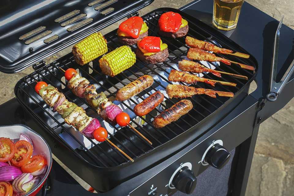 An Argos Home 2 Burner gas BBQ with a side burner.