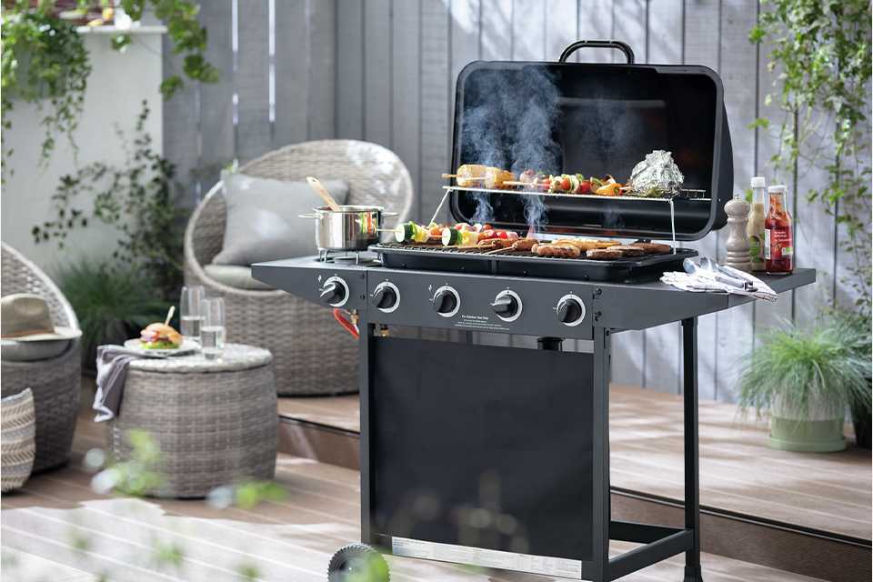 An Argos Home 4 burner gas BBQ with a side burner.