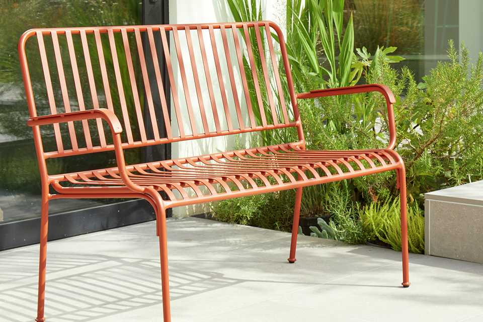 Habitat Indu 2 Seater metal garden bench in red.