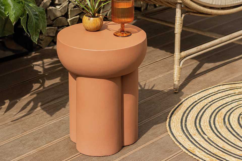 Habitat Palma round concrete effect garden side table in brown colour.