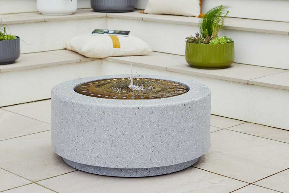 Ivyline Solis large water feature in terrazzo and brass finish.