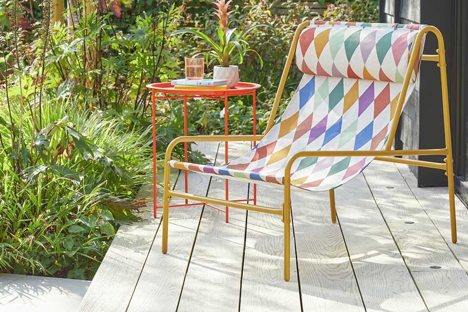 A Habitat Teka Harlequin metal garden chair.