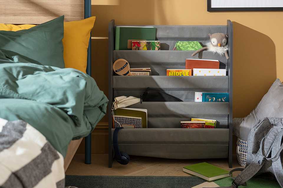 Grey book tidy in a kid's room.