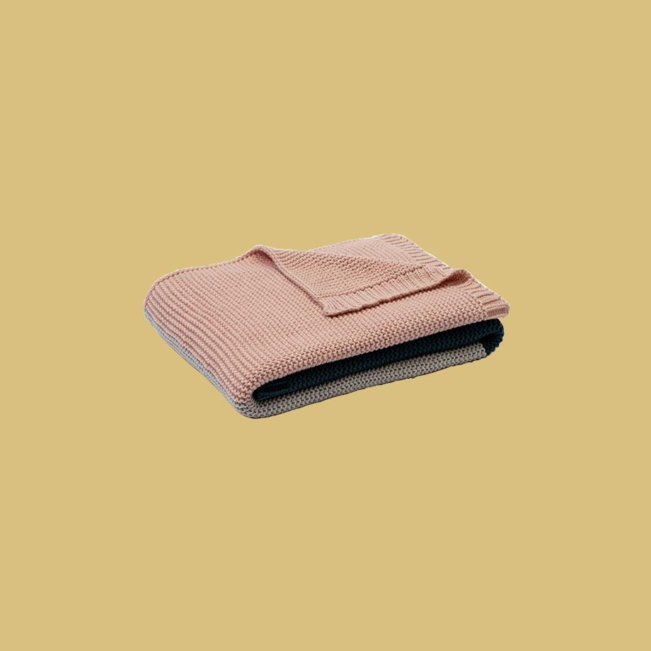Scandi throw lying on a kid's bed.