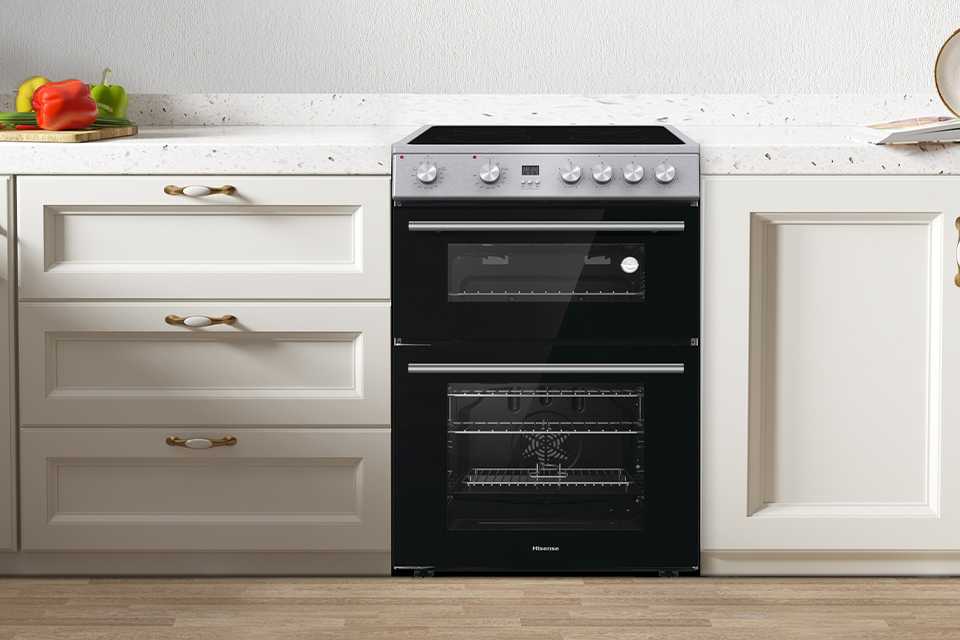 A Hisense HDE3211BXUK 60cm Double Oven Electric Cooker in a kitchen.