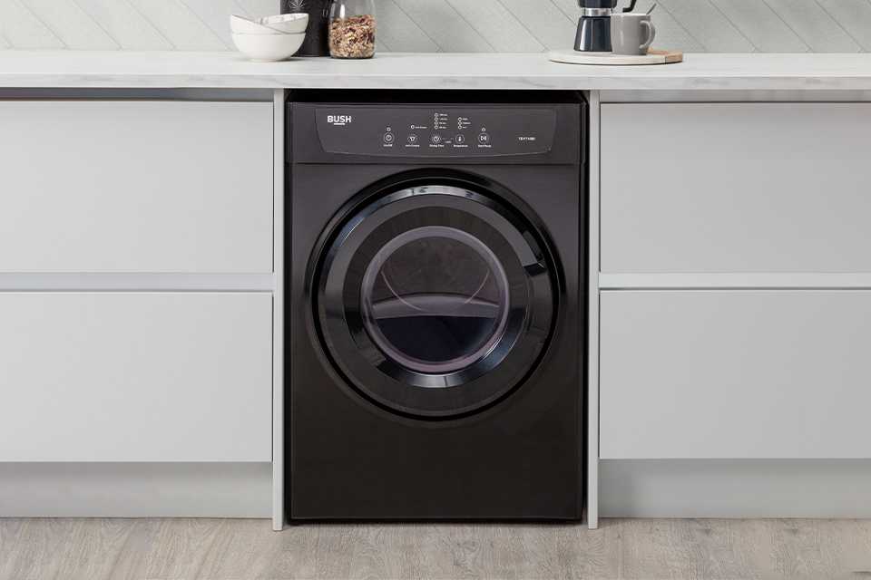 A Bush black 7kg integrated washing machine.