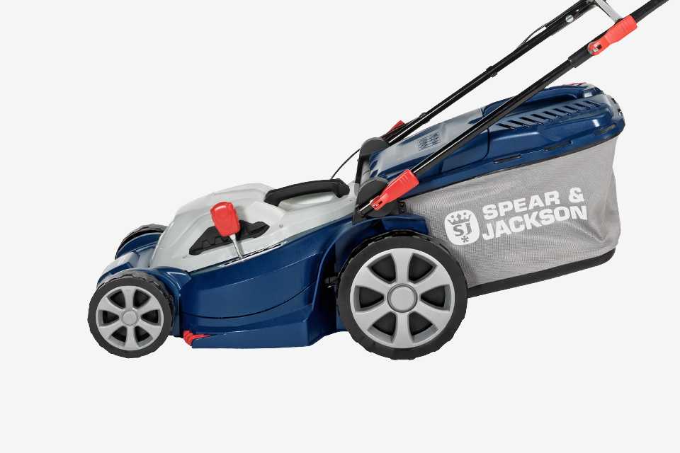 A close up image of a lawnmower with a grass box.