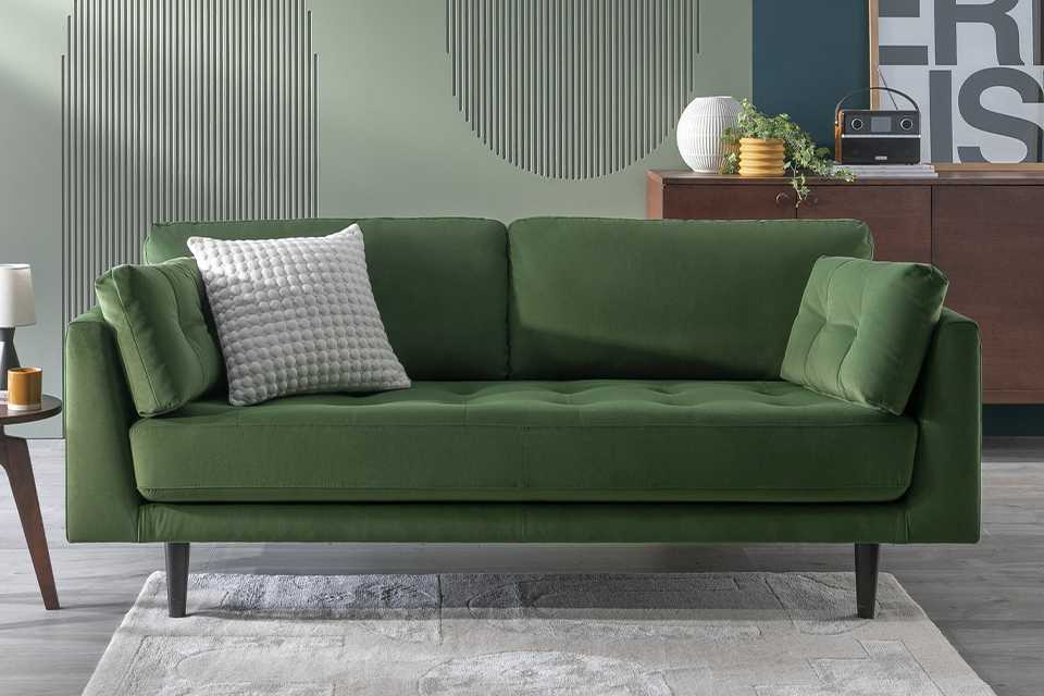 A green Habitat sofa in a living room.