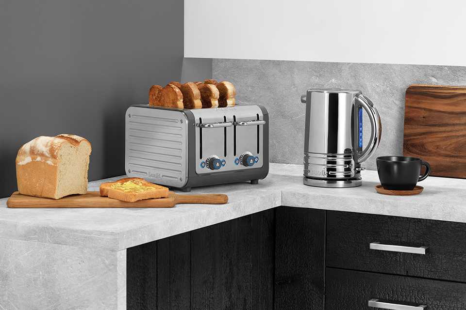 Dualit 4 slot Architect toaster and Architect kettle in grey body with stainless steel panels.