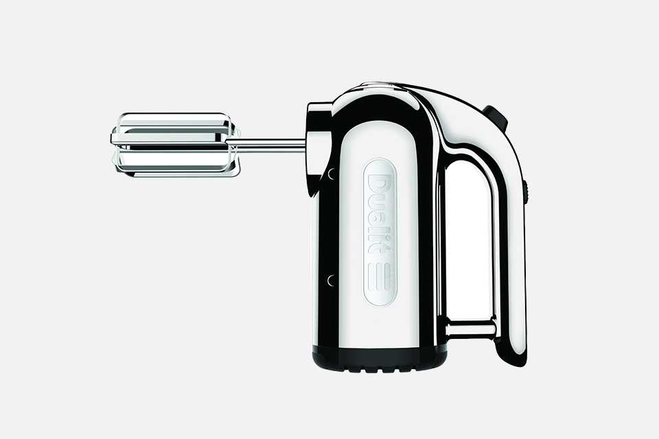 Sideview of a chrome Dualit electric hand mixer.