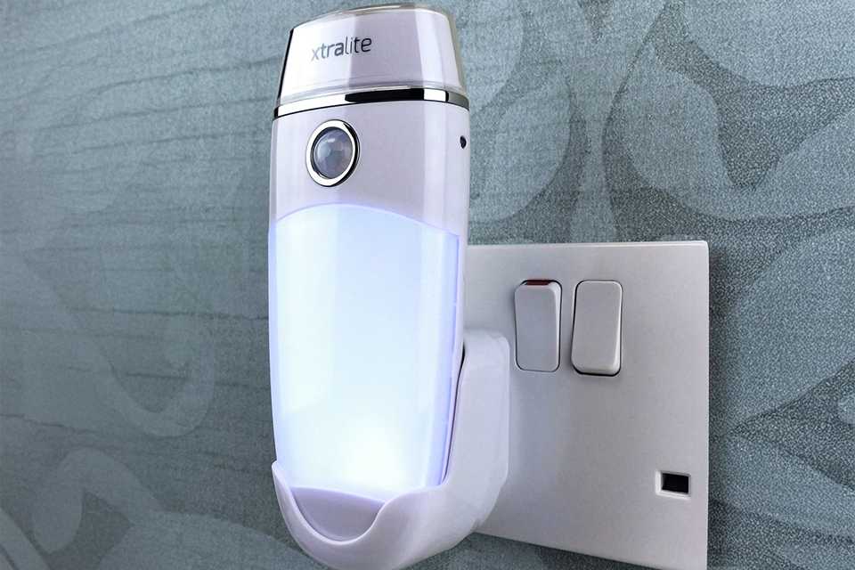 An Xtralite Nitesafe Duo+ Dual Function Night Light - White in a room.