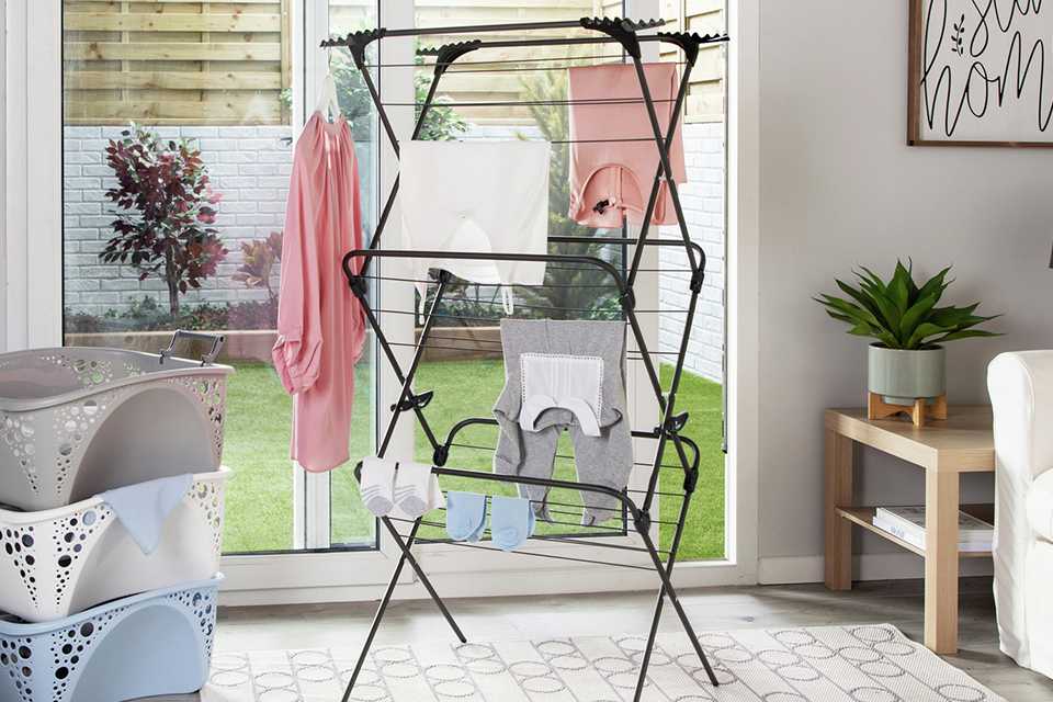 Clothes drying on a clothes airer in the house.