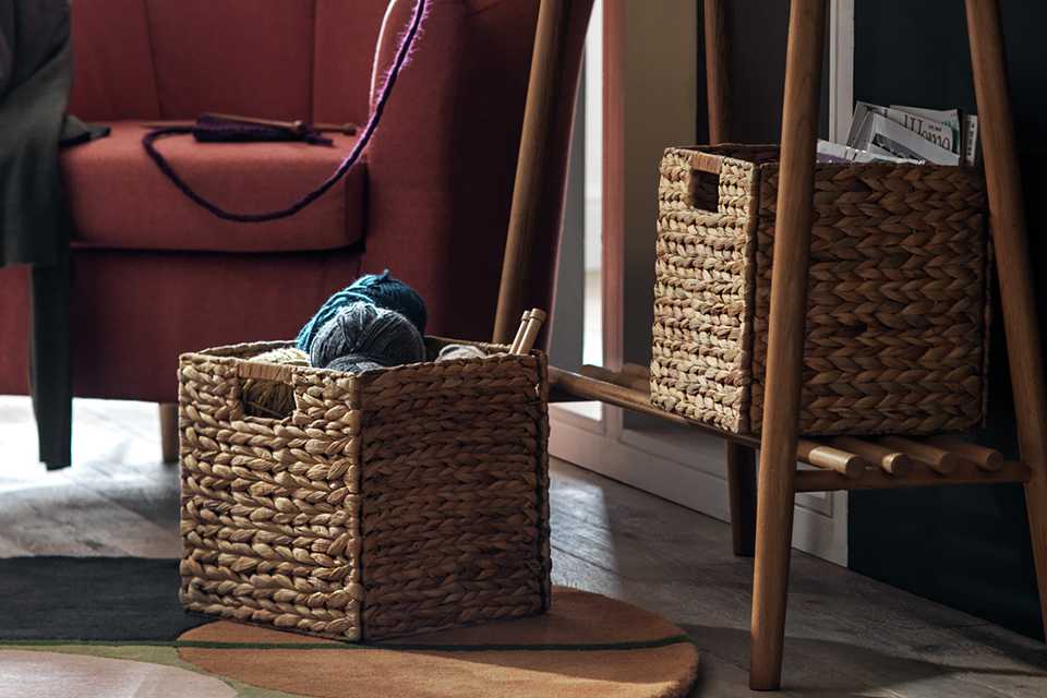 Wooden cub storage boxes on console table.