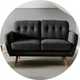 A Habitat Finney fabric 2 seater sofa in charcoal in a living room.
