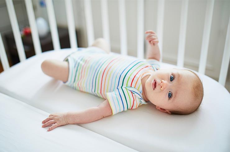 Baby in a cot.