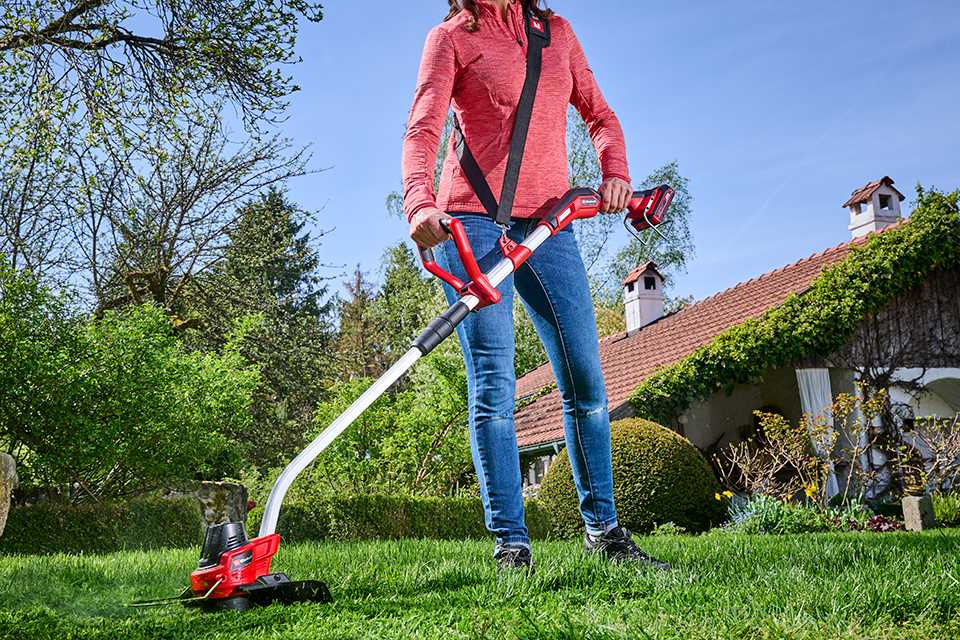 A person using Einhell cordless grass trimmer.