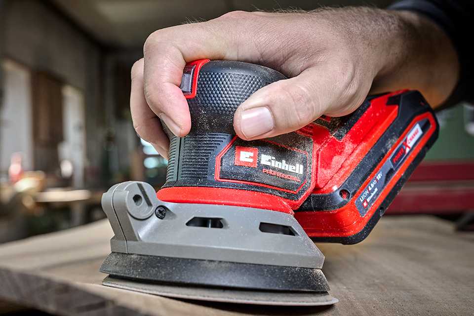 An Einhell cordless sander device in use.