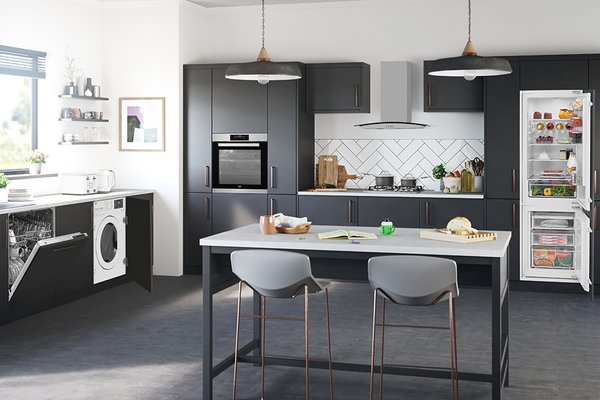 : Image shows a sleek, monochrome kitchen with Beko appliances including a washing machine, dishwasher and fridge freezer.