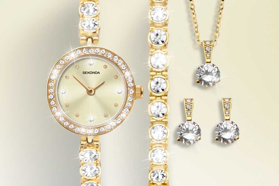 A Sekonda crystal and gold watch, bracelet, necklace and earrings gift set.
