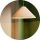 A Habitat cone taper lampshade hanging from the ceiling in a room.