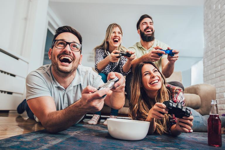 A group of friends play video games.