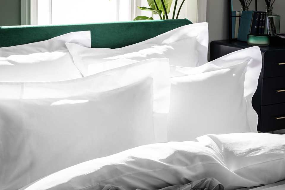 A set of white Egyptian cotton oxford pillowcases.
