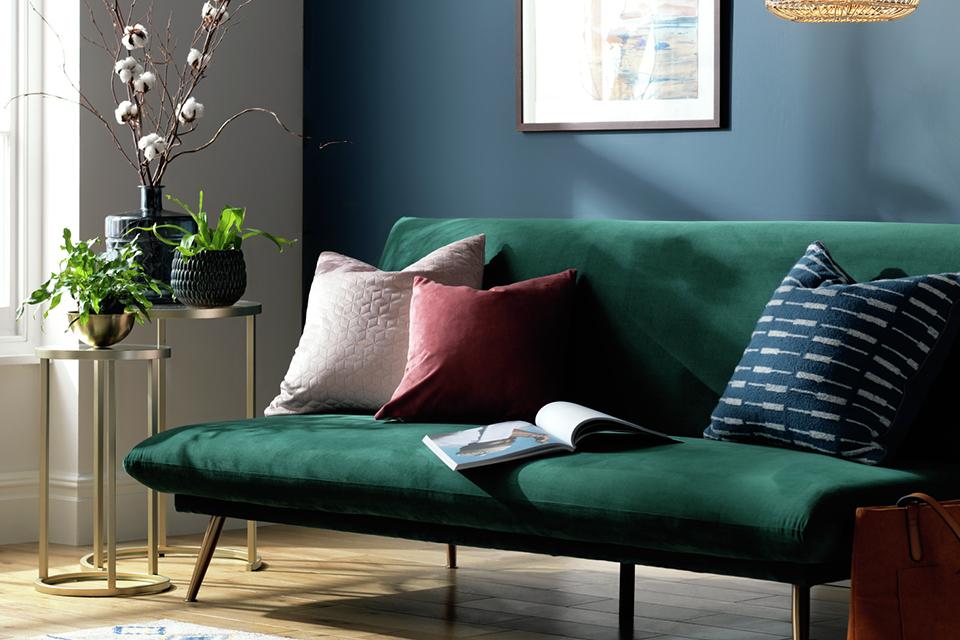 Habitat Matteo 2 seater velvet sofa bed in green colour.