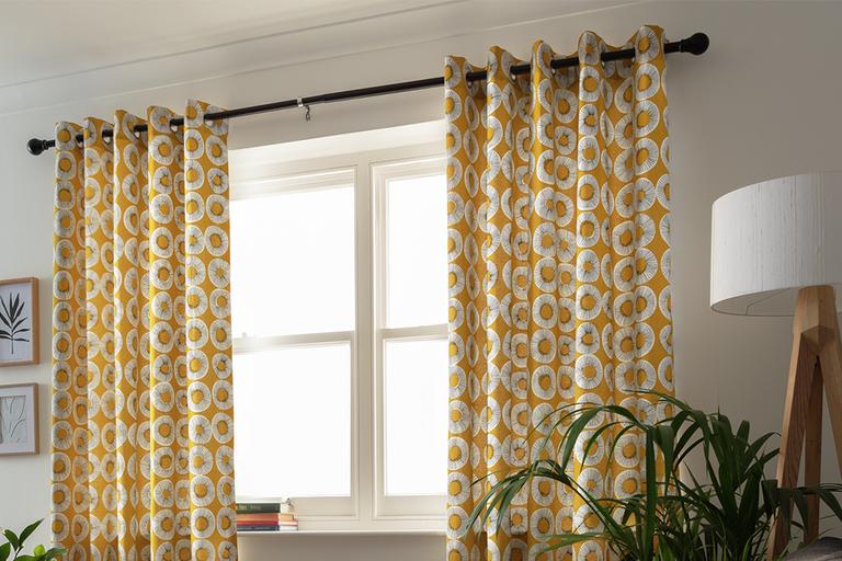 Habitat Evelyn print lined eyelet yellow curtains.