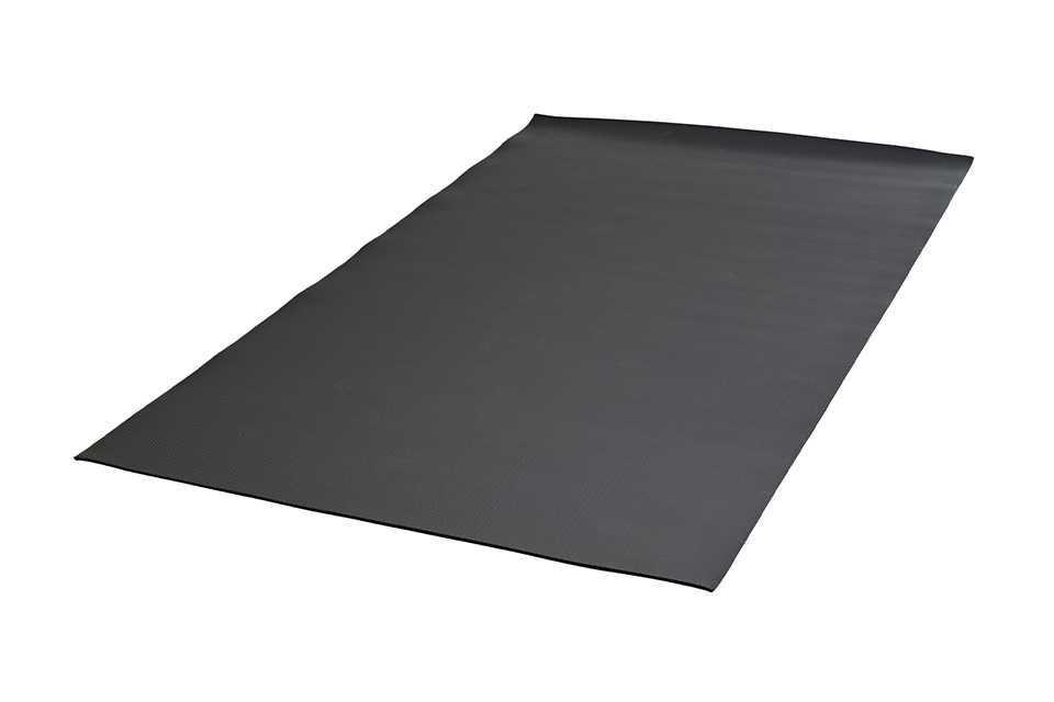 A large black exercise equipment mat.