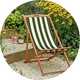 A Habitat folding wooden garden deck chair in green and white.